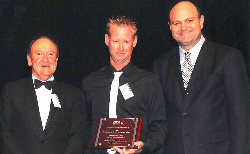 Emerald truckie Raymond Barrie (middle) with his Queensland Trucking Association’s Professional Driver of the Year award at the ceremony in Brisbane recently. Emerald truckie Raymond Barrie (middle) with his Queensland Trucking Association’s Professional Driver of the Year award at the ceremony in Brisbane recently.